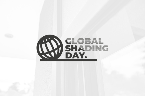 Logo displaying a stylized globe with the text "GLOBAL SHADING DAY." in front of a blurred indoor setting with a window, suggesting a focus on environmental or architectural shading concepts.