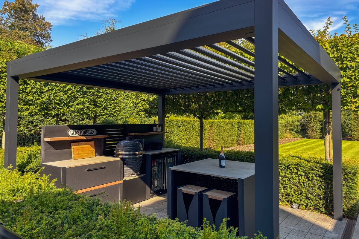 an outdoor pergola with cooking facilities