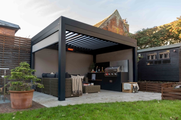 an outdoor pergola with cooking facilities
