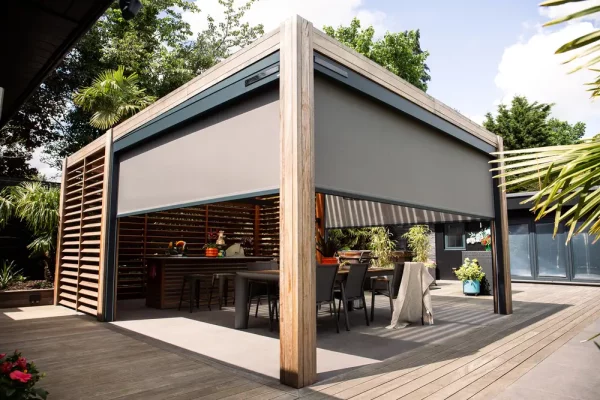 a patio awning complete with shading over a set of patio chairs